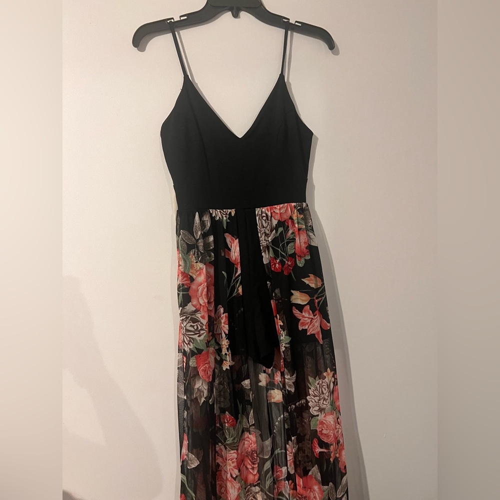 Romper with high/lo tail. Only used once. Size Medium.